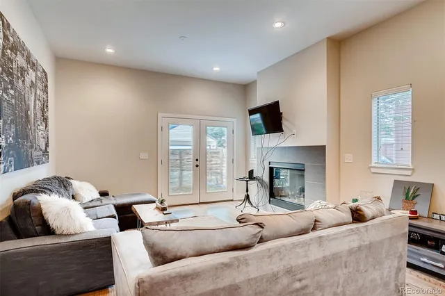a living room with furniture fireplace and flat screen tv