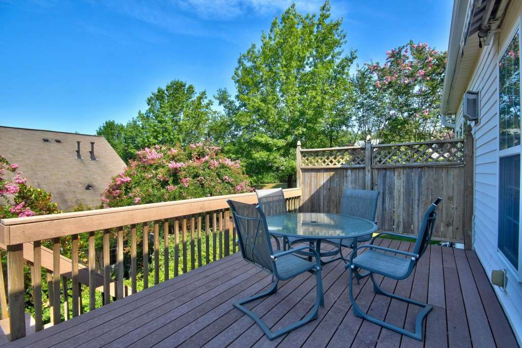 7725 Monte Alto Drive Raleigh, NC 27613 - Photo 25 of 25 Great sized Trex deck to grill out or enjoy your morning coffee! Retractable awning is remote so you can have some shade if you prefer. Deck