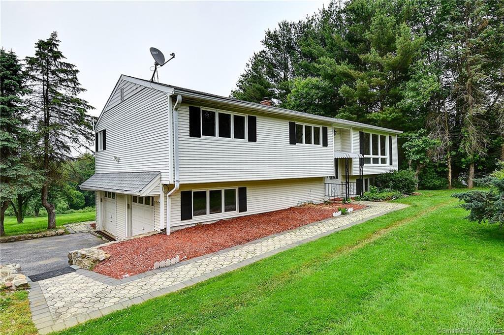1284 Litchfield Road Watertown, CT 06795 - Photo 1 of 1 a front view of a house with a yard and porch