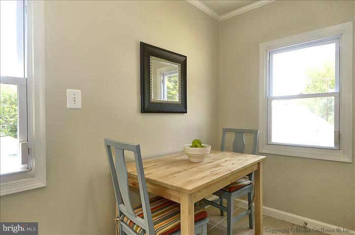 11708 Idlewood Road Silver Spring, MD 20906 - Photo 2 of 21 a view of a dining room that has a table and a chair