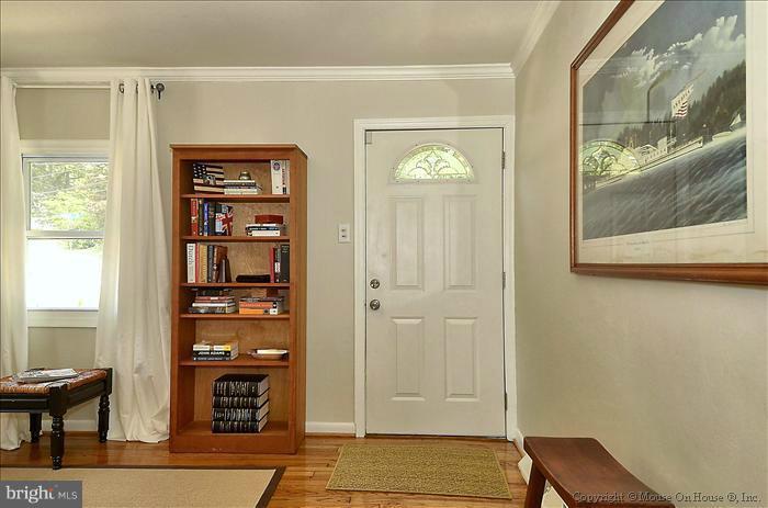 11708 Idlewood Road Silver Spring, MD 20906 - Photo 11 of 21 a view of front door with wooden floor