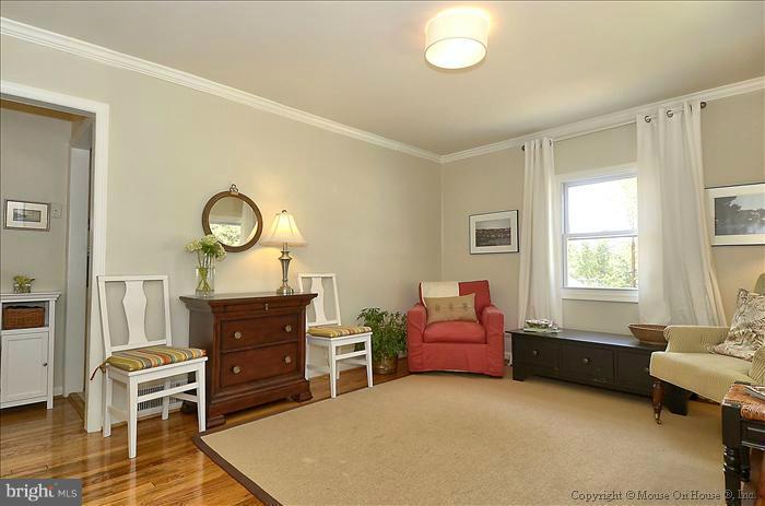 11708 Idlewood Road Silver Spring, MD 20906 - Photo 15 of 21 a living room with furniture and a window