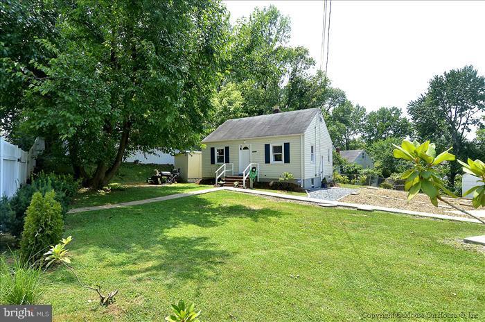 11708 Idlewood Road Silver Spring, MD 20906 - Photo 21 of 21 a front view of a house with a yard