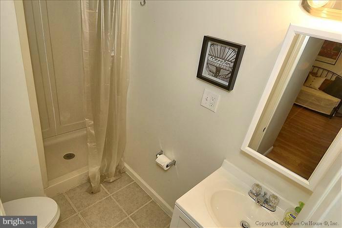 11708 Idlewood Road Silver Spring, MD 20906 - Photo 6 of 21 a bathroom with a sink and toilet
