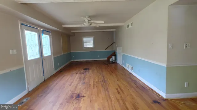 a view of entryway with wooden floor