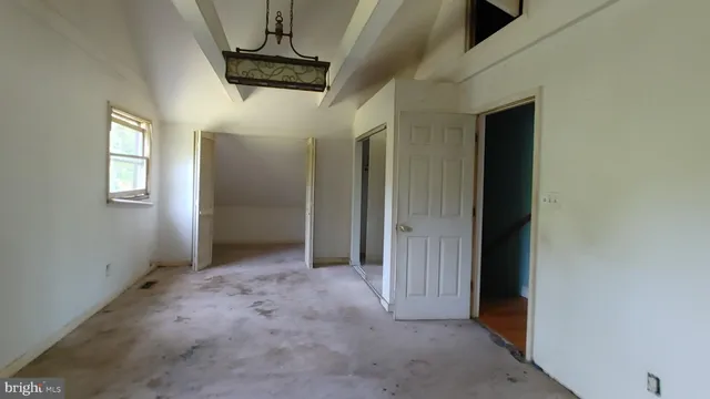 a view of a hallway with windows