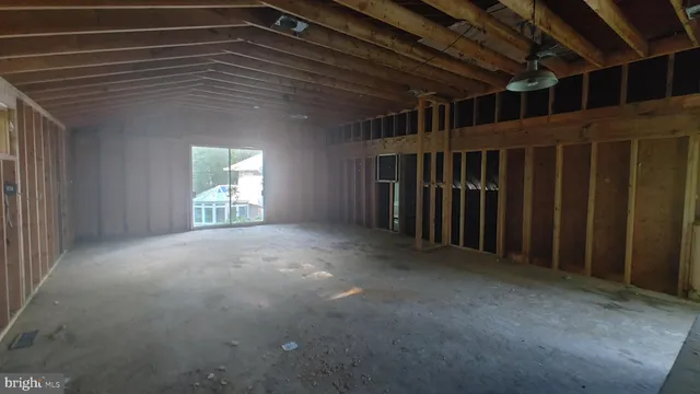 a view of empty room with windows