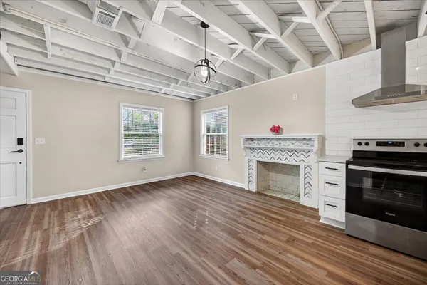 a kitchen with sink a window and cabinets