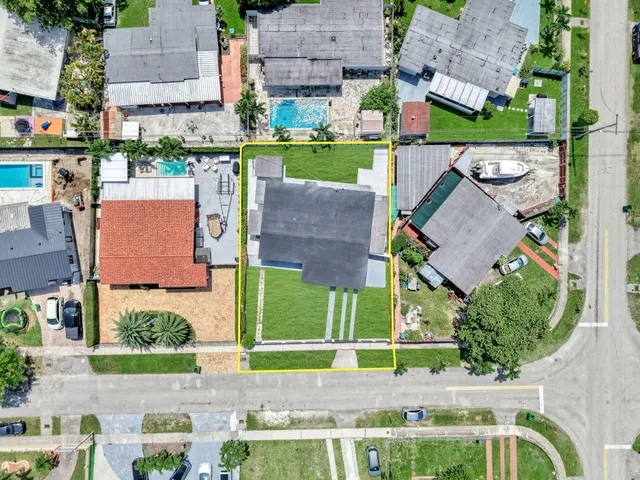 an aerial view of a house with a garden and plants