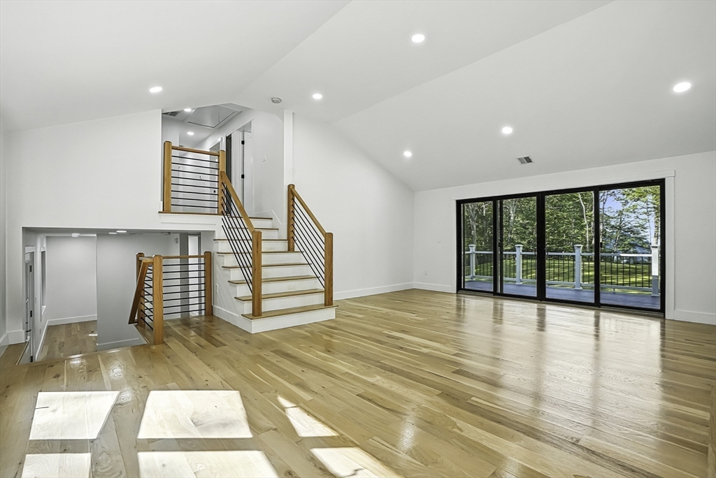 68 Pearl Street Upton, MA 01568 - Photo 12 of 37 a view of an empty room with stairs