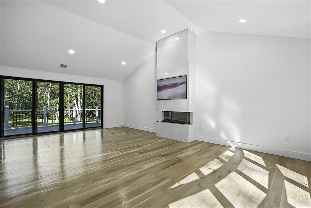 68 Pearl Street Upton, MA 01568 - Photo 15 of 37 a view of empty room with wooden floor and fan