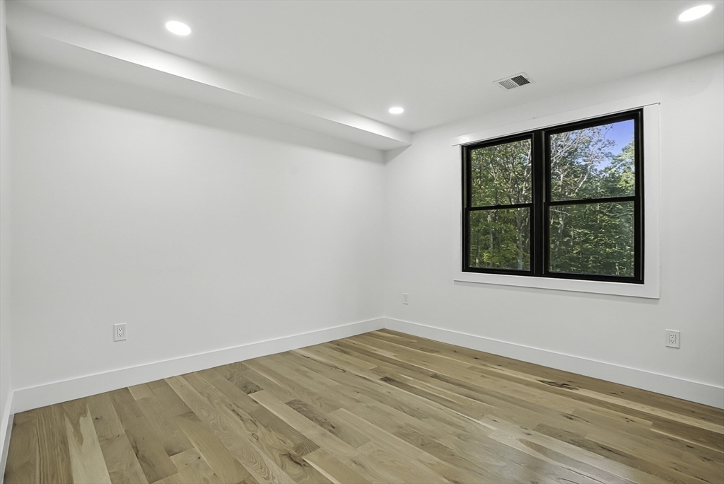 68 Pearl Street Upton, MA 01568 - Photo 21 of 37 wooden floor in an empty room with a window