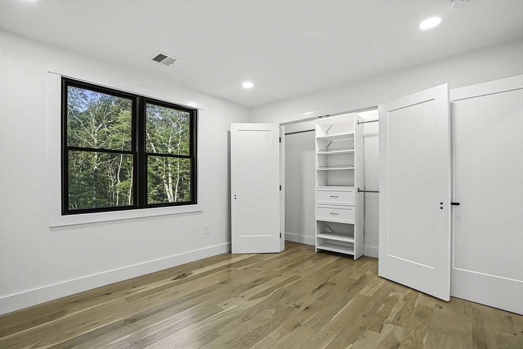 68 Pearl Street Upton, MA 01568 - Photo 22 of 37 wooden floor in an empty room with a window