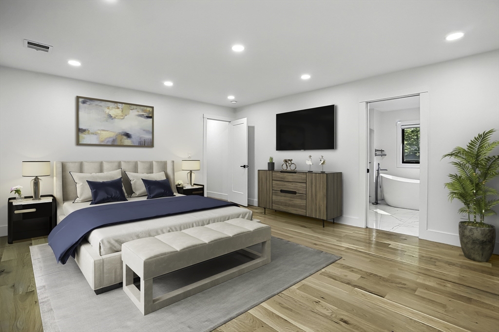 68 Pearl Street Upton, MA 01568 - Photo 25 of 37 a spacious bedroom with a large bed and a flat screen tv