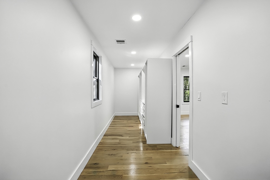 68 Pearl Street Upton, MA 01568 - Photo 26 of 37 a view of a hallway with wooden floor