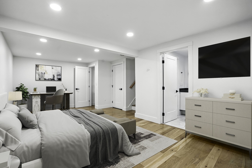 68 Pearl Street Upton, MA 01568 - Photo 30 of 37 a bedroom with a bed and a flat screen tv