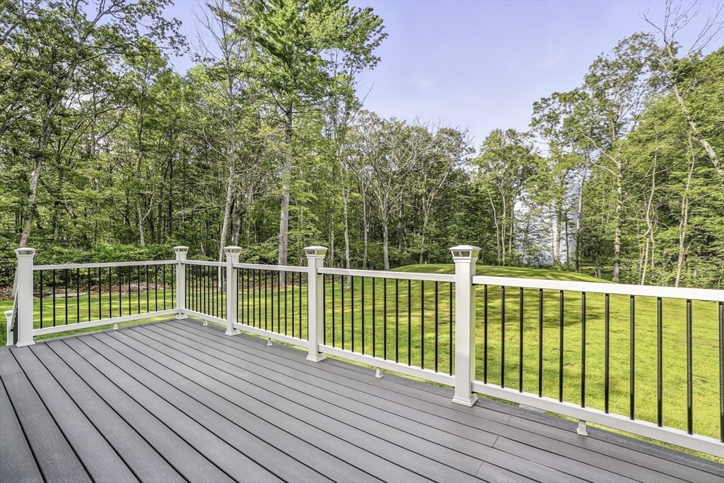68 Pearl Street Upton, MA 01568 - Photo 33 of 37 a view of balcony with wooden floor and fence