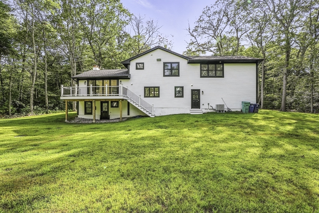 68 Pearl Street Upton, MA 01568 - Photo 34 of 37 a front view of a house with a yard