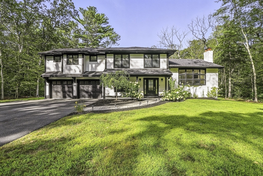 68 Pearl Street Upton, MA 01568 - Photo 36 of 37 a view of a white house with a large pool table and chairs