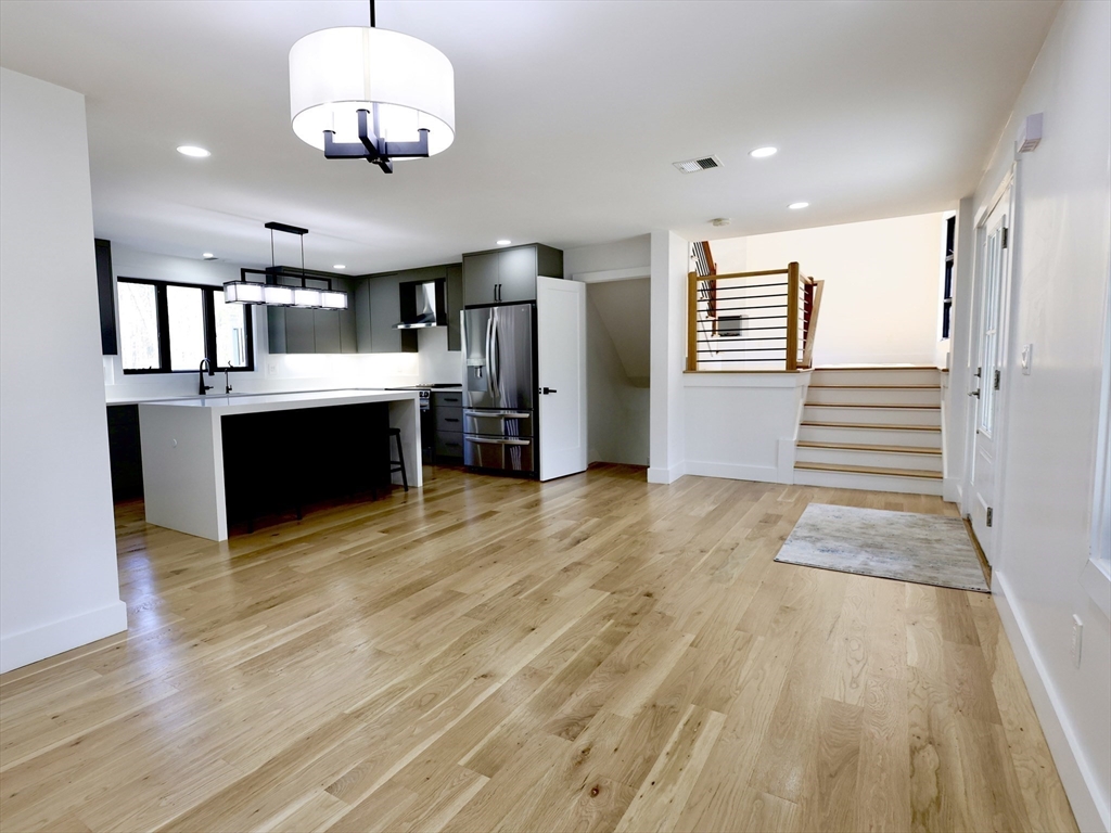 68 Pearl Street Upton, MA 01568 - Photo 6 of 37 a view of kitchen with cabinets and wooden floor
