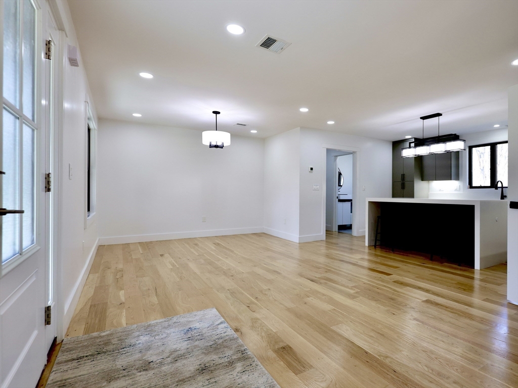 68 Pearl Street Upton, MA 01568 - Photo 7 of 37 a view of kitchen and hall with wooden floor