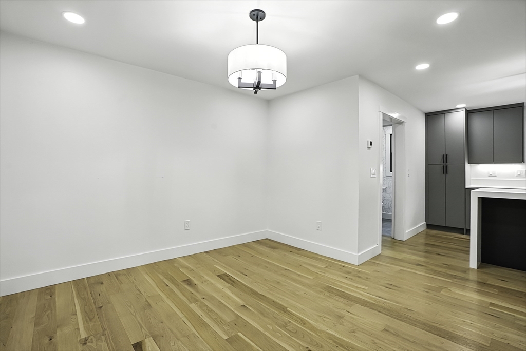 68 Pearl Street Upton, MA 01568 - Photo 8 of 37 a view of a livingroom with wooden floor