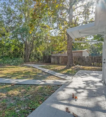 a view of a yard with an outdoor space