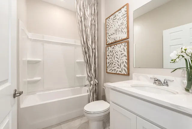 a bathroom with a sink a toilet and a bathtub