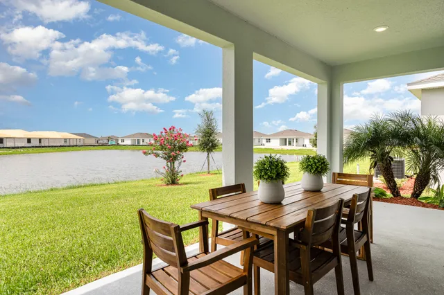 a view of swimming pool with a table and chairs