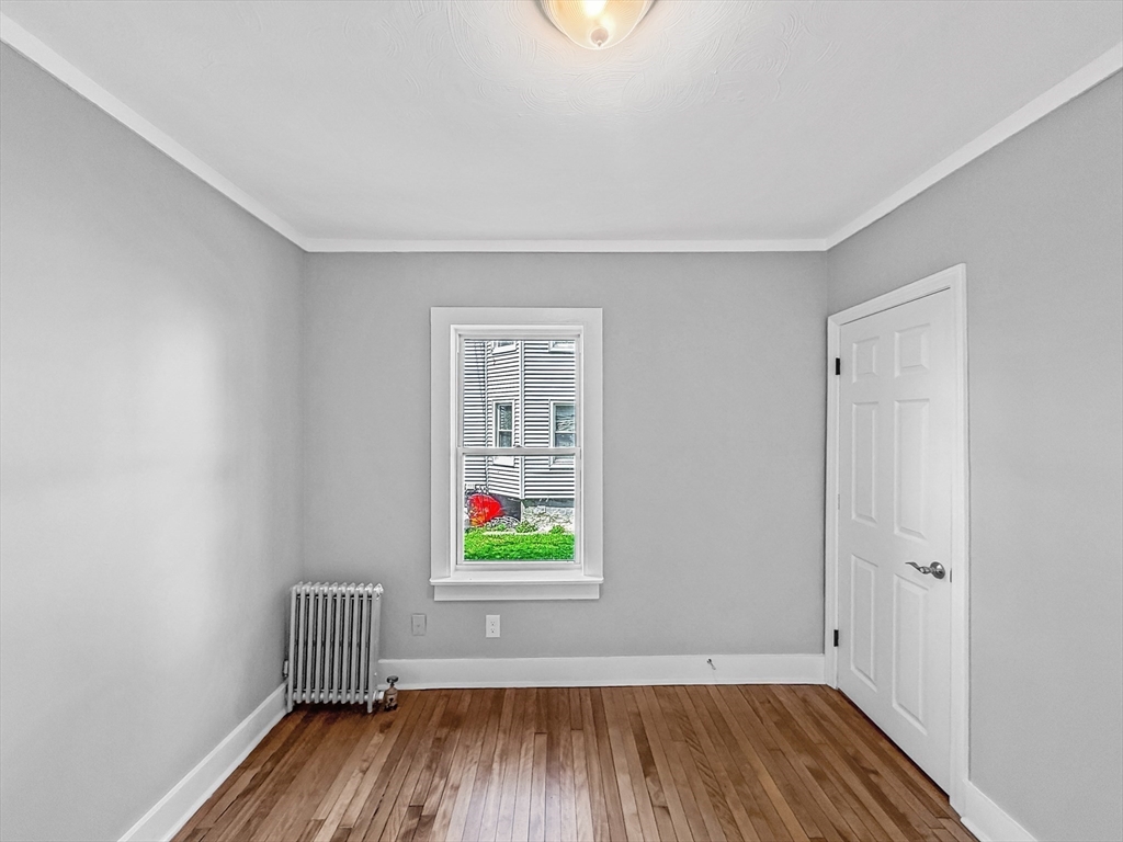 70 Cutler Street Worcester, MA 01604 - Photo 16 of 42 wooden floor in an empty room with a window