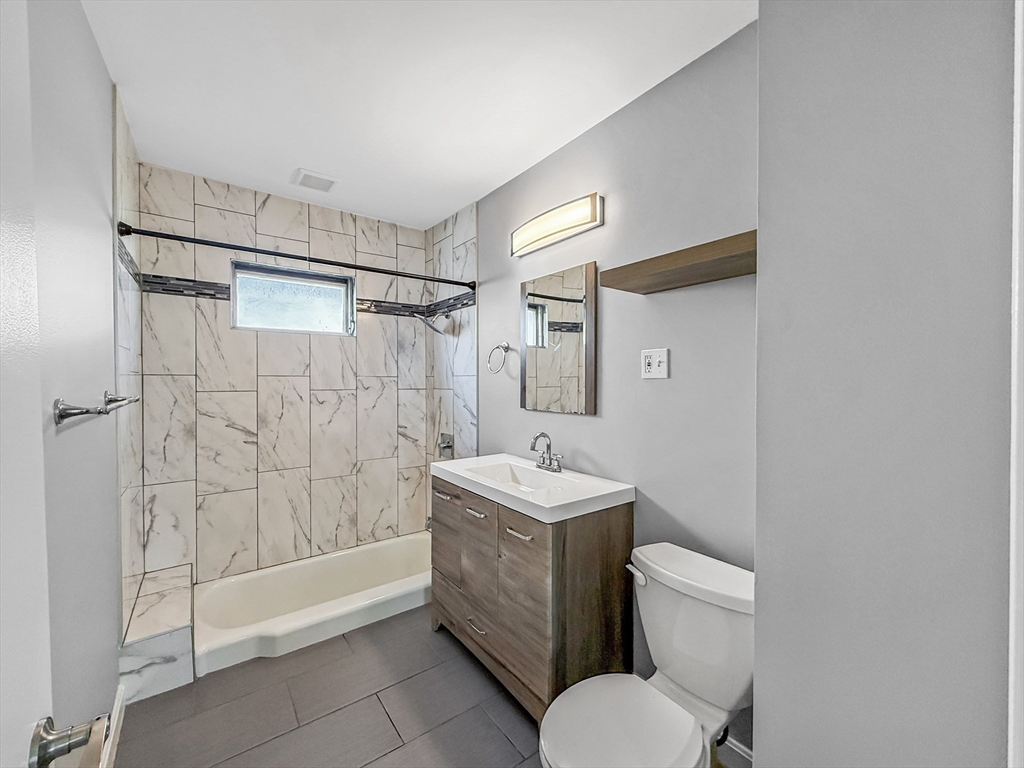 70 Cutler Street Worcester, MA 01604 - Photo 17 of 42 a bathroom with a toilet sink and shower