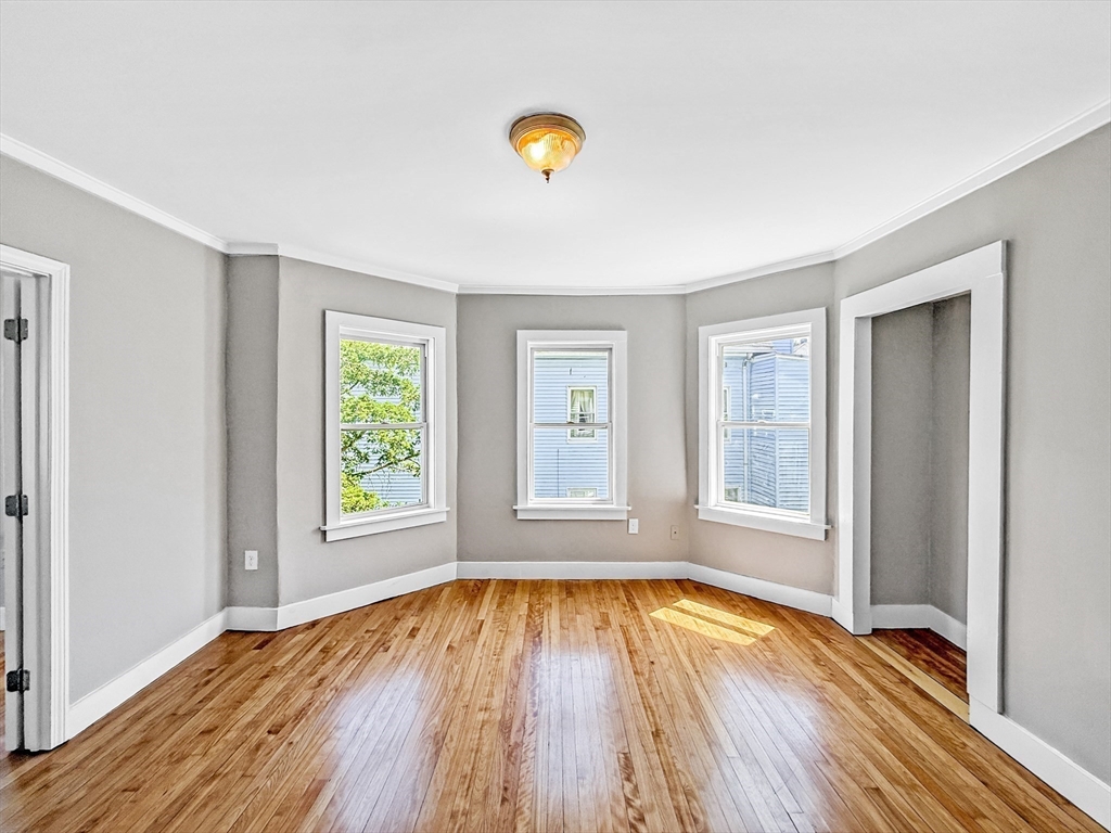 70 Cutler Street Worcester, MA 01604 - Photo 22 of 42 a view of empty room with wooden floor and fan