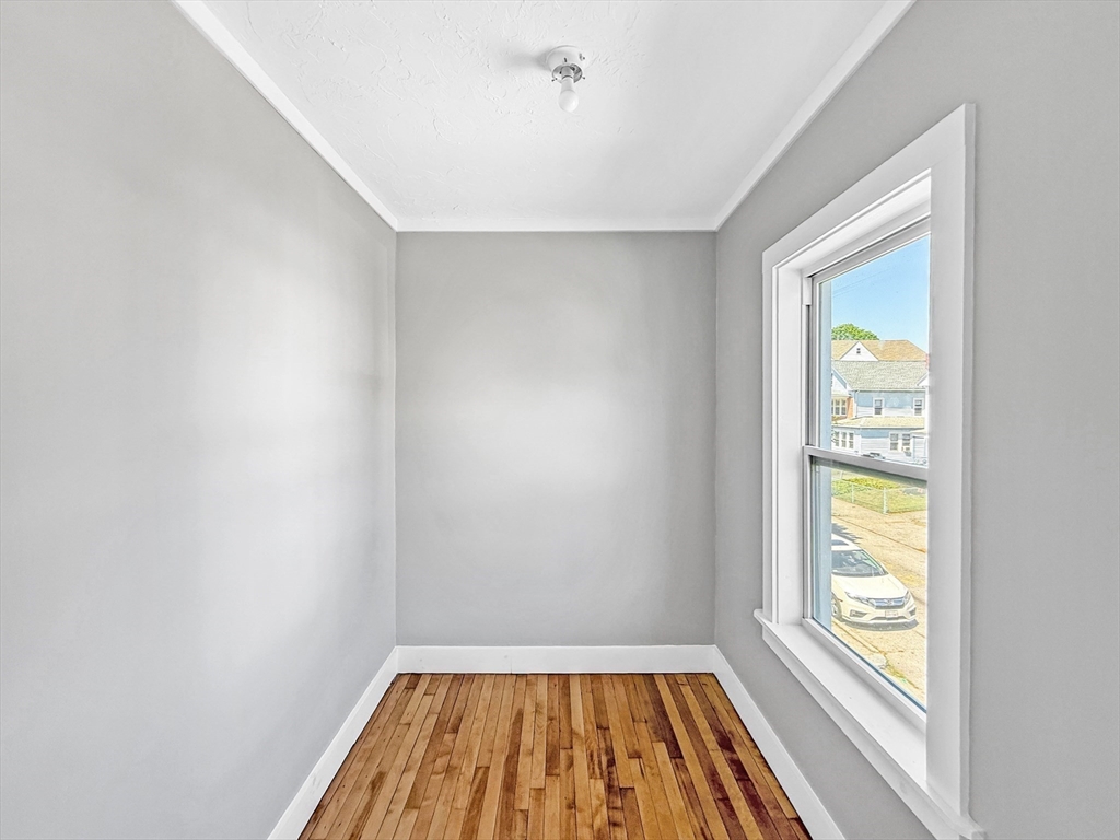70 Cutler Street Worcester, MA 01604 - Photo 25 of 42 a view of room with window and wooden floor