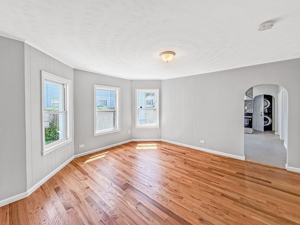 70 Cutler Street Worcester, MA 01604 - Photo 3 of 42 a view of empty room with wooden floor and window