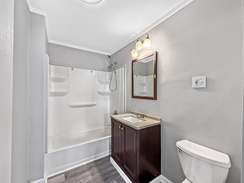 70 Cutler Street Worcester, MA 01604 - Photo 33 of 42 a bathroom with a toilet sink and shower