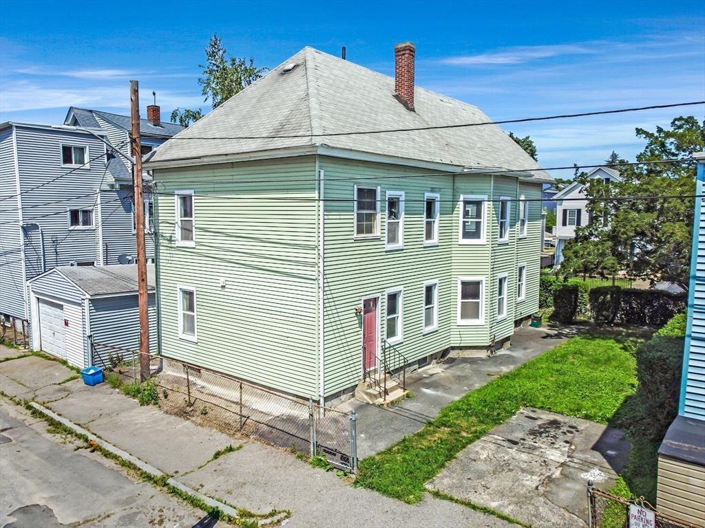 70 Cutler Street Worcester, MA 01604 - Photo 39 of 42 a front view of a house with a yard