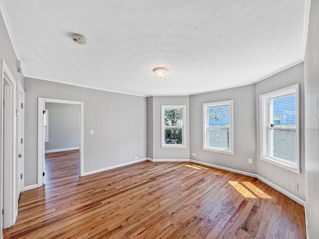 70 Cutler Street Worcester, MA 01604 - Photo 5 of 42 a view of empty room with wooden floor and fan