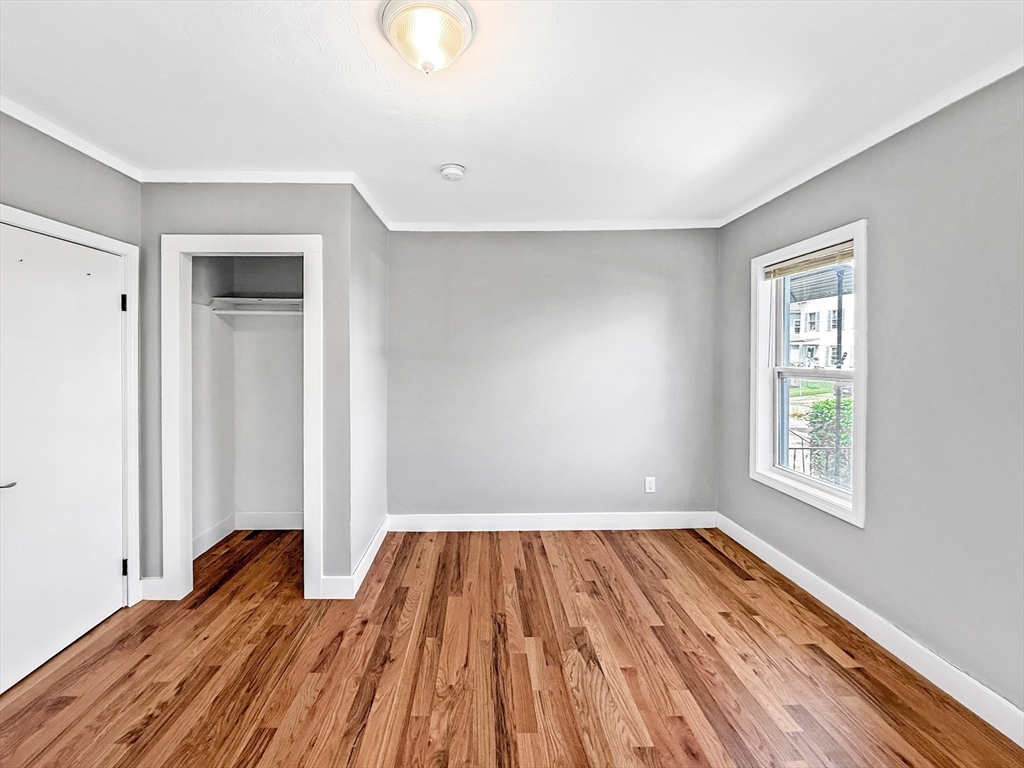 70 Cutler Street Worcester, MA 01604 - Photo 10 of 42 wooden floor in an empty room with a window