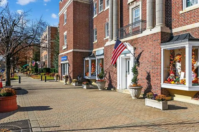 a view of a building with sitting area
