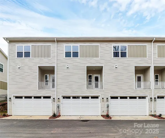 a front view of a house with a garage
