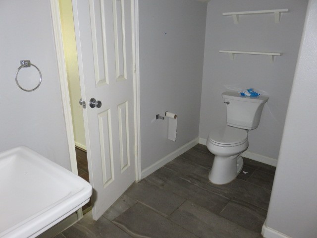 12127 Landsdown Ridge Way Humble, TX 77346 - Photo 13 of 35 a white toilet sitting next to a bathroom sink