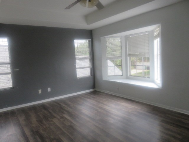 12127 Landsdown Ridge Way Humble, TX 77346 - Photo 16 of 35 a view of an empty room with wooden floor and a window