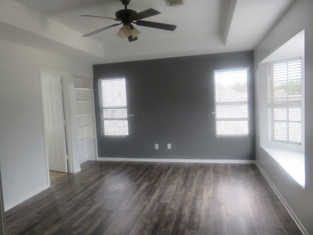 12127 Landsdown Ridge Way Humble, TX 77346 - Photo 17 of 35 an empty room with wooden floor and windows