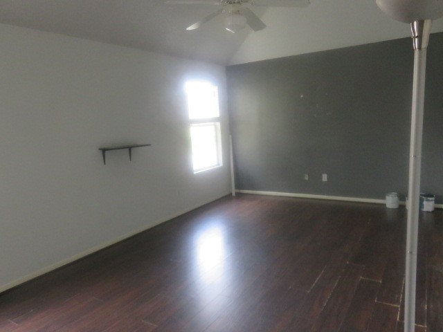 12127 Landsdown Ridge Way Humble, TX 77346 - Photo 22 of 35 an empty room with wooden floor and windows