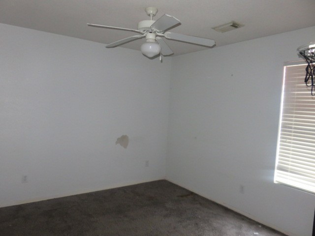 12127 Landsdown Ridge Way Humble, TX 77346 - Photo 28 of 35 an empty room with a window and a fan
