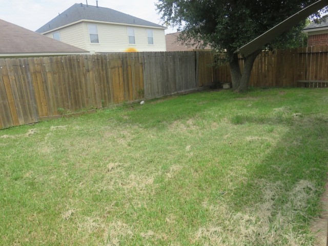 12127 Landsdown Ridge Way Humble, TX 77346 - Photo 31 of 35 a view of a backyard