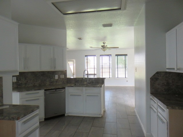 12127 Landsdown Ridge Way Humble, TX 77346 - Photo 5 of 35 a kitchen with a sink stove and cabinets