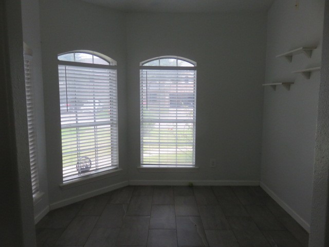 12127 Landsdown Ridge Way Humble, TX 77346 - Photo 6 of 35 a view of an empty room with a window