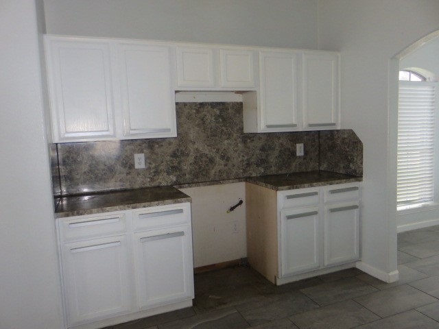 12127 Landsdown Ridge Way Humble, TX 77346 - Photo 10 of 35 a kitchen with white cabinets and white appliances
