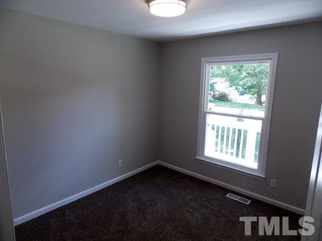 5624 Pelham Road Durham, NC 27713 - Photo 13 of 15 an empty room with a window